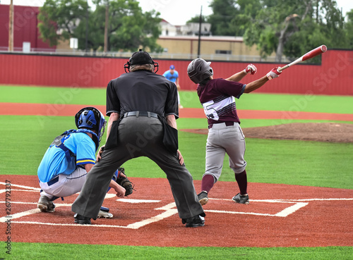 Young athletic boys playing sport of baseball