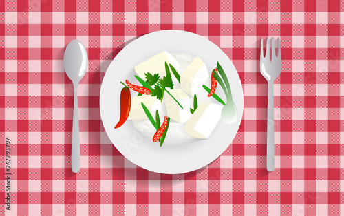tofu in the white plate on the red tablecloth