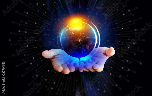 Close up of businessman hand holding digital globe and virtual hologram. element of this image furnished by NASA.