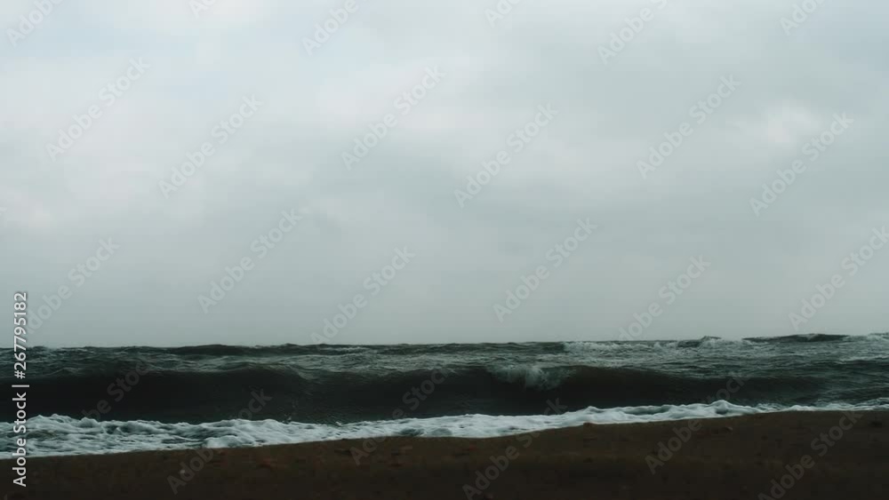 view from the coast to the srtong waves in cloudy weather view from the coast to the srtong waves in cloudy weather