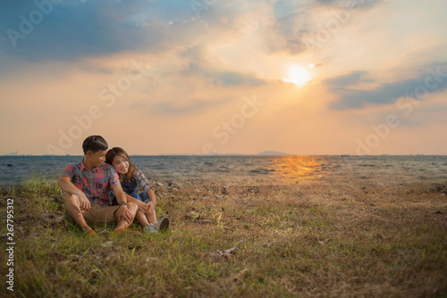 Romantic couple relaxing on grass