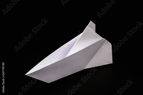 paper boat isolated on black background  handmade paper origami.