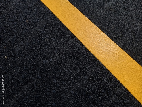 Road traffic paint Yellow on the asphalt surface