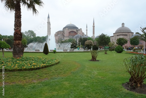 View of the Hagia Sophia, a fountain and green lawn in Istanbul, Turkey.