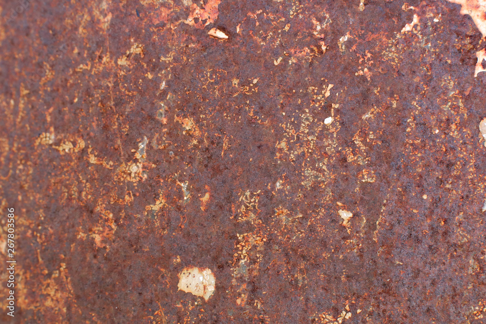 Rusty yellow-red textured metal surface. The texture of the metal sheet is prone to oxidation and corrosion. Textured background in grunge Style Rusty yellow-red textured metal surface. The texture of the metal sheet is prone to oxidation and corrosion. Textured background in grunge Style