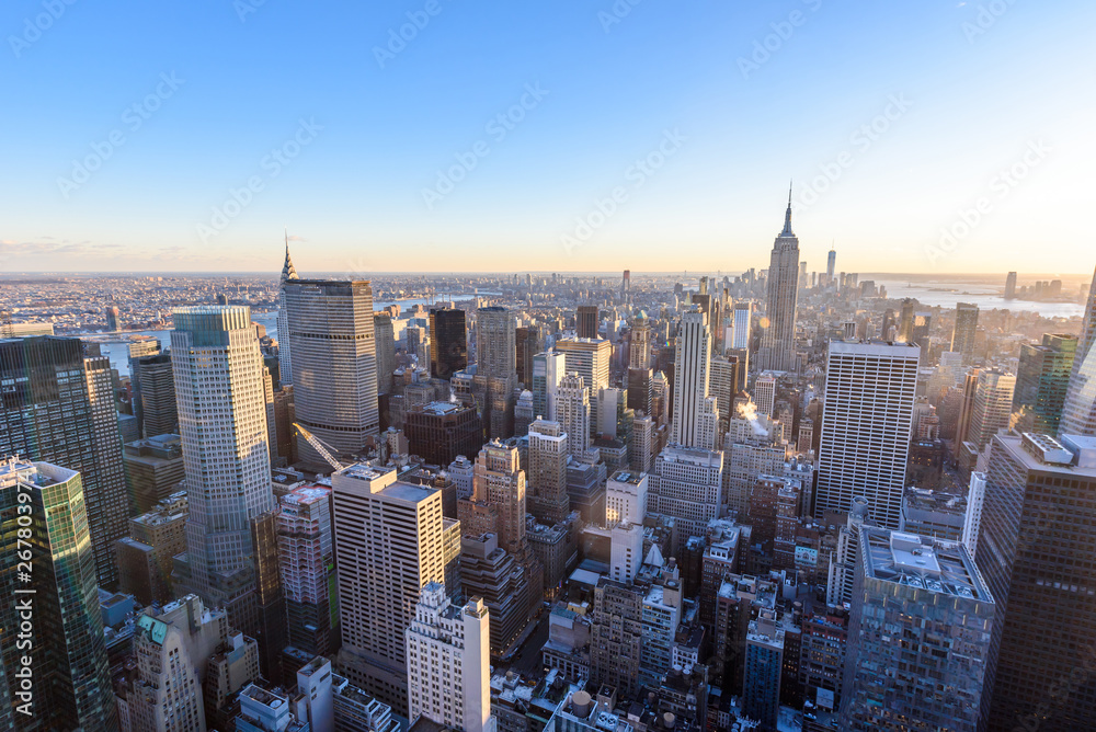 Panorama view of Midtown Manhattan skyline with the Empire State Building from the Rockefeller Center Observation Deck. Top of the Rock - New York City, USA