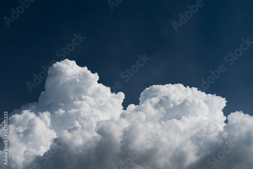 Closeup cumulonimbus clouds in summer with blue sky