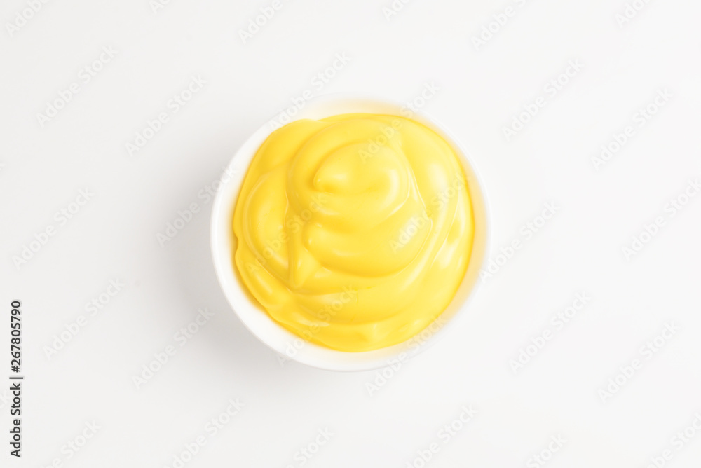 Cheese sauce in white plate on white background. Cheese sauce in white plate on white background.