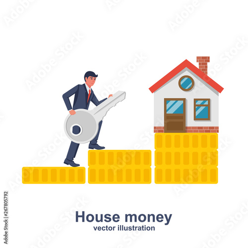 The seller with the key runs on a stack of coins for sale at home.