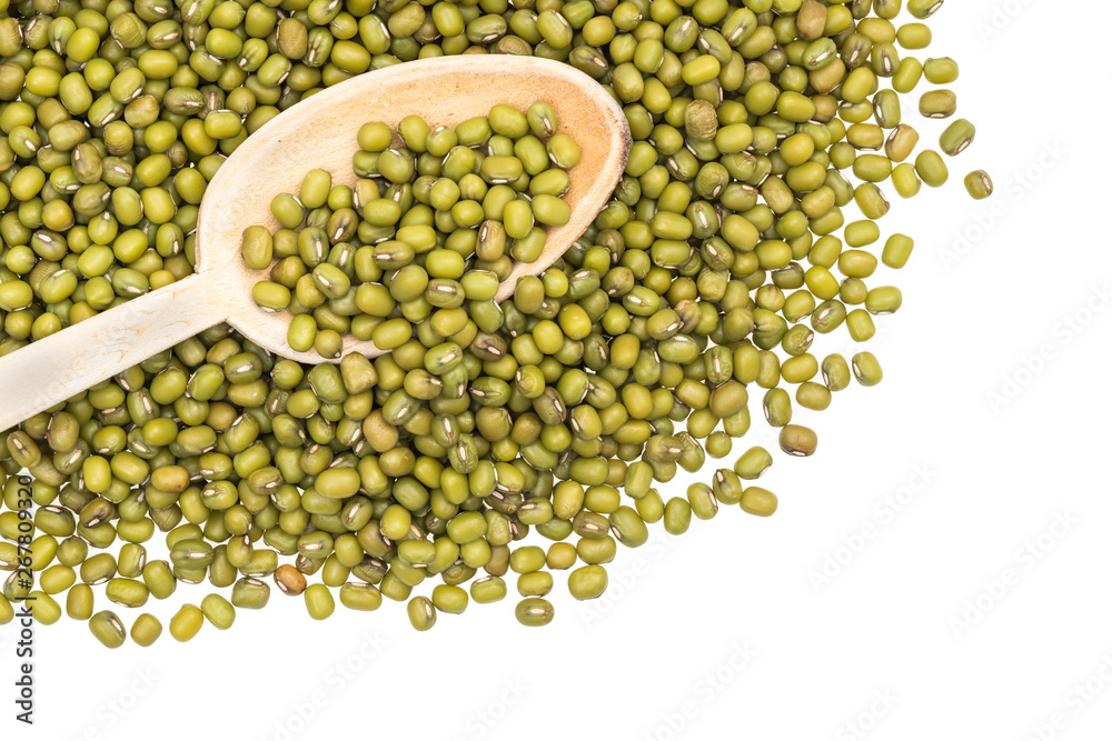 Mung beans spread out from upper left corner with wooden spoon seen directly from above and isolated on white background Mung beans spread out from upper left corner with wooden spoon seen directly from above and isolated on white background