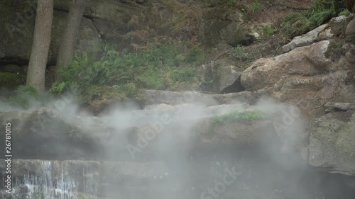 Water steam under waterfall, flowing water.