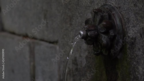 Wellspring with crystalline, pure and bright water. Low angle.
