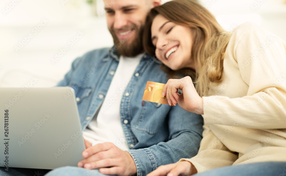 Online Shopping. Happy Couple Using Laptop And Credit Card Online Shopping. Happy Couple Using Laptop And Credit Card