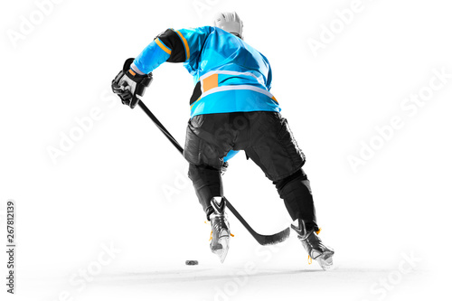 Professional ice hockey player in action on white backgound