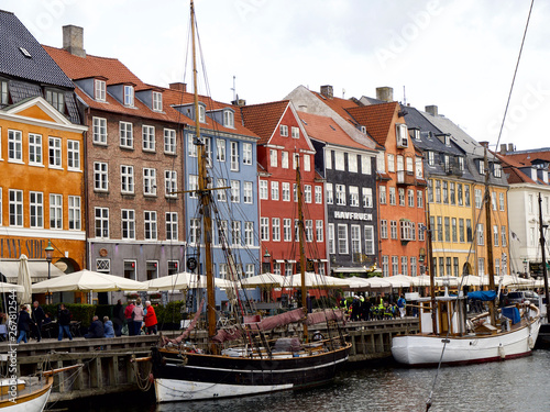 Nyhavn with colorful facades of old houses and old ships in the Old Town of Copenhagen © seongjin