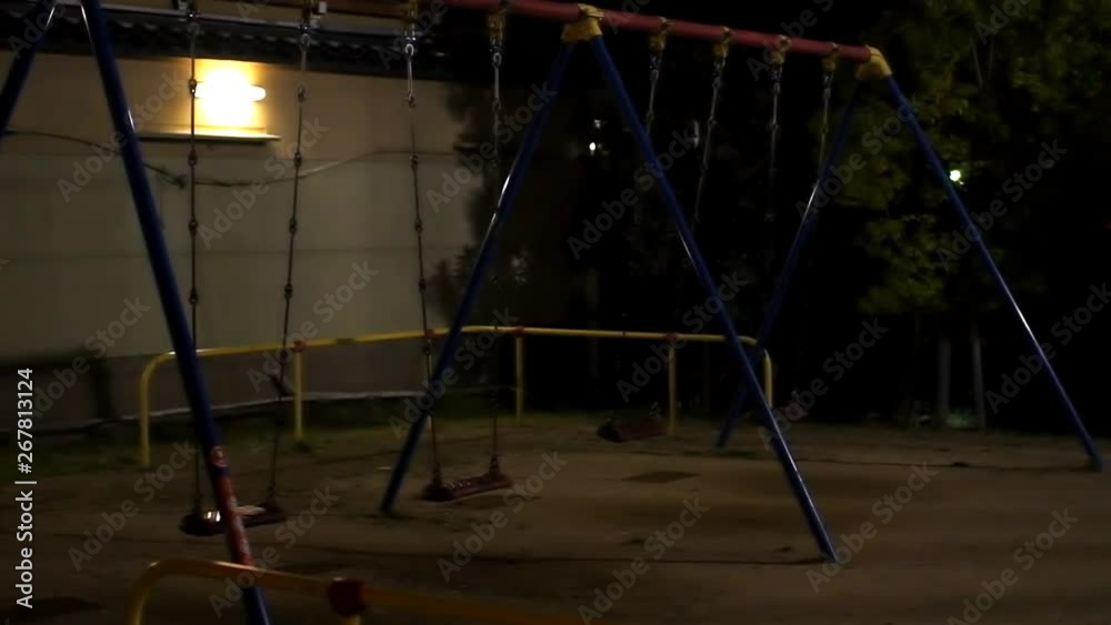 Kyoto, Japan empty playground at night in slow motion with creepy swings swinging and nobody in slow motion Kyoto, Japan empty playground at night in slow motion with creepy swings swinging and nobody in slow motion