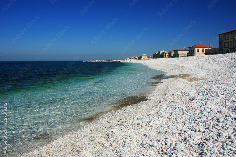 Sea stone coast of the blue-green sea