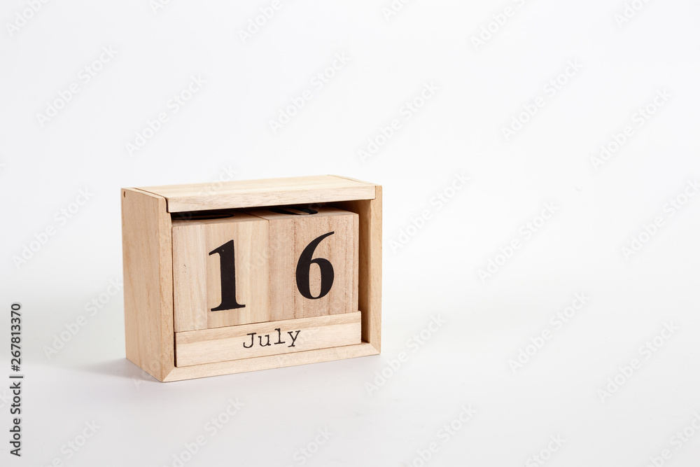 Wooden calendar July 16 on a white background Wooden calendar July 16 on a white background