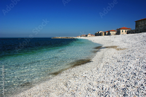 Sea stone coast of the blue-green sea