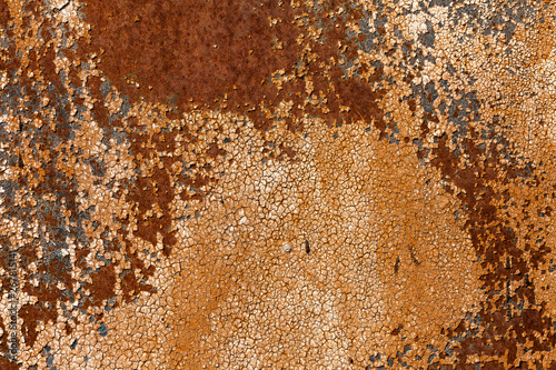 Rusty yellow-red textured metal surface. The texture of the metal sheet is pr...