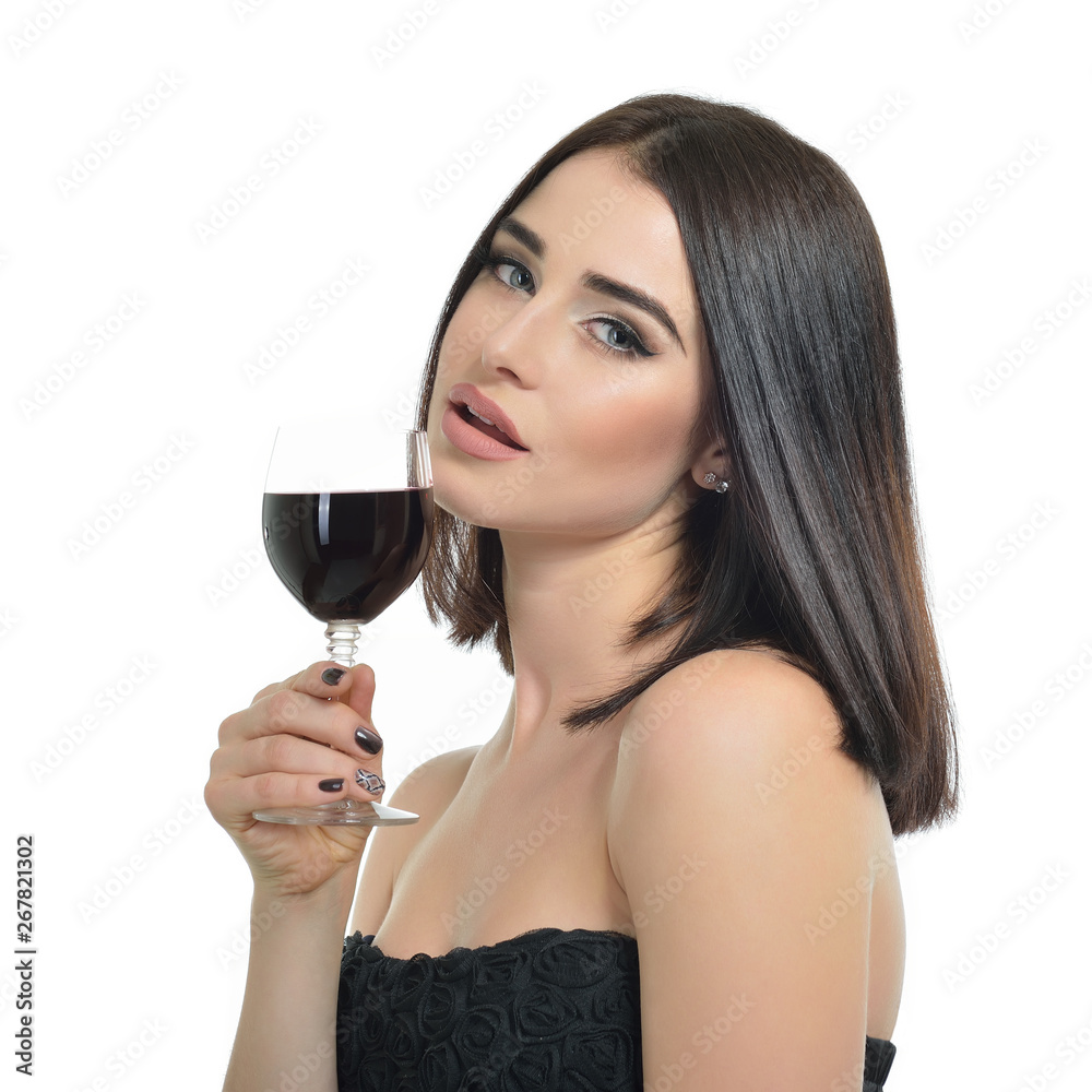 Young attractive woman holding glass of red wine. Pretty lady drinks alcoholic drink Young attractive woman holding glass of red wine. Pretty lady drinks alcoholic drink