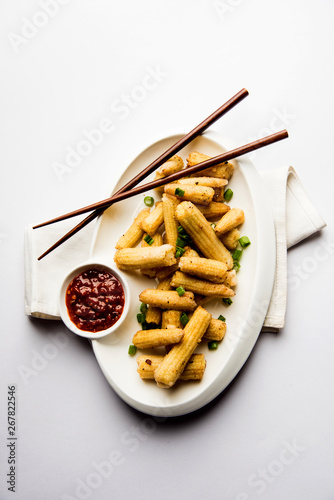 Baby Corn Manchurian dry - popular Indo-chinese starter recipe. selective focus