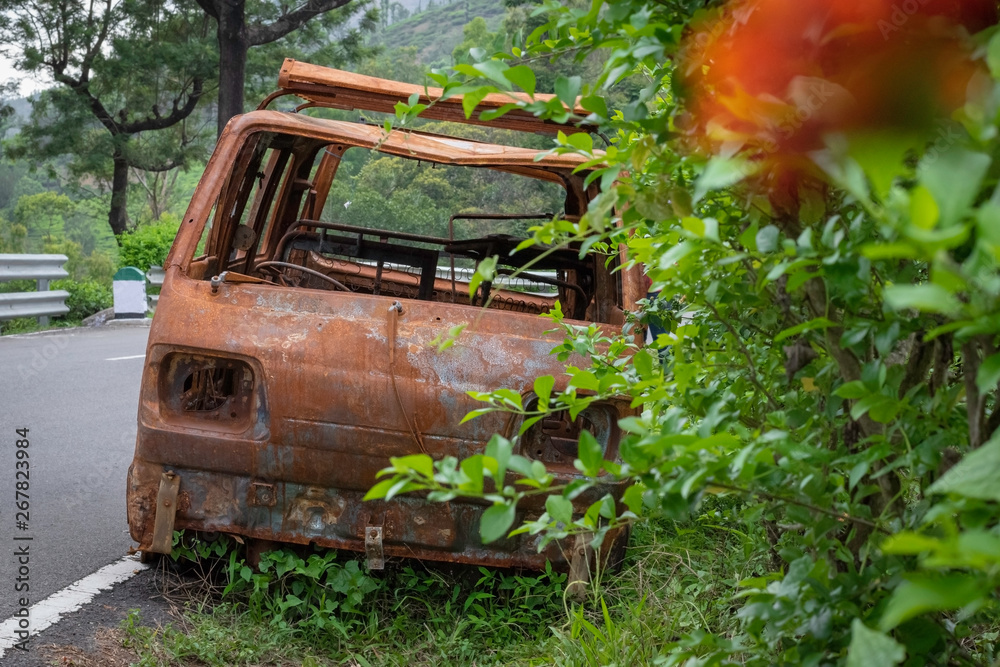 Abandoned van parked in side of hill road in a foggy bright day Abandoned van parked in side of hill road in a foggy bright day