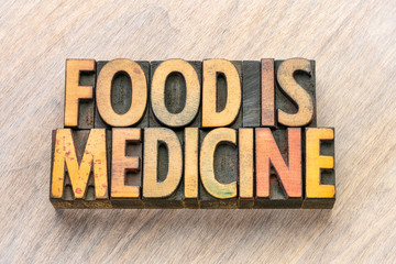 food is medicine text in wood type