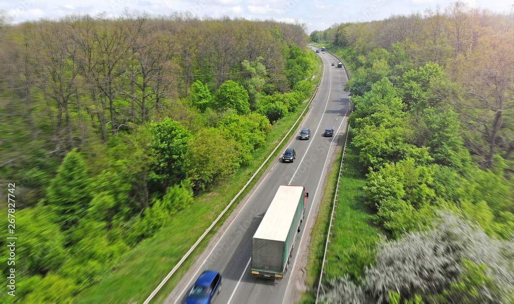 Highway intercity traffic with truck and cars. Transport logistic background. Highway intercity traffic with truck and cars. Transport logistic background.