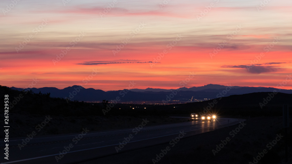 Cars on the highway at sunrise in Southern Nevada Cars on the highway at sunrise in Southern Nevada