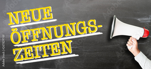 text NEUE ÖFFNUNGSZEITEN, German for new opening hours or changed business hours, with hand holding red and white megaphone
