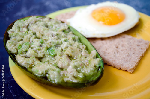 dish with avocado and egg for breakfast