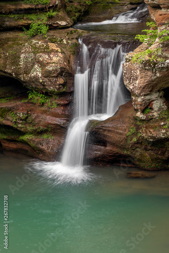 Spring Splash - A beautiful Ohio waterfall, the Upper Falls at Old Man’s Cave in Hocking Hills State Park, splashes down a colorful sandstone cliff after spring rains.