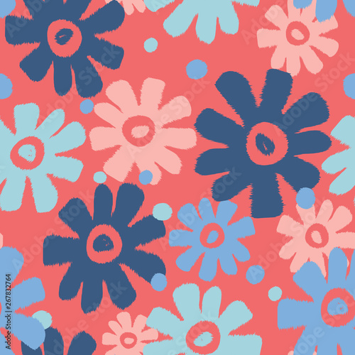 Overlapping flower shapes seamless pattern on a coral background with shades of blue and light pink. 1960's feel but modern color palette. Great for spring and summer textiles, decor and fashion.
