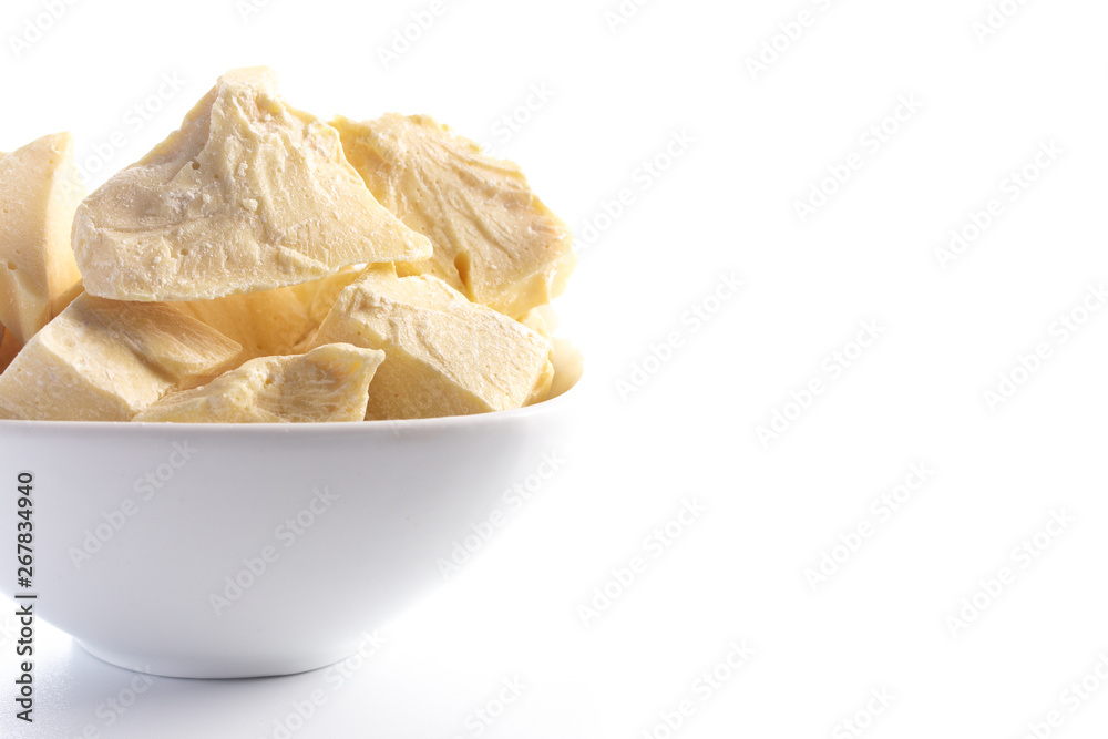 Chunks of Raw Organic Cocoa Butter on a White Background Chunks of Raw Organic Cocoa Butter on a White Background