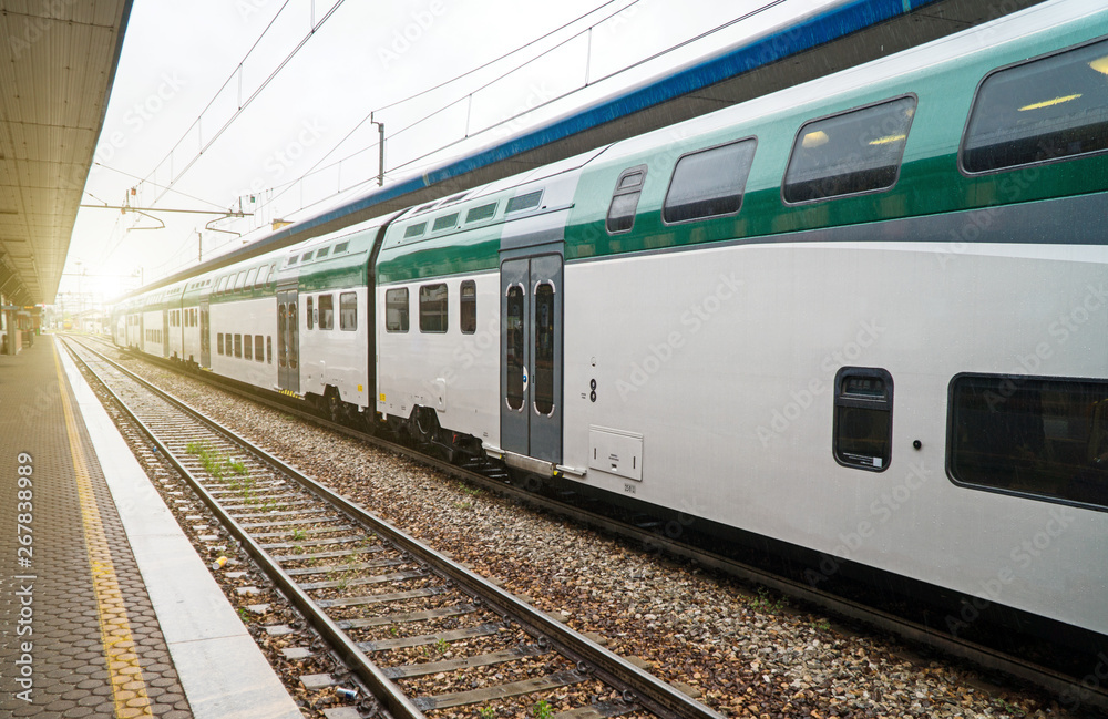 Double-decker train at the railway station in Italy.