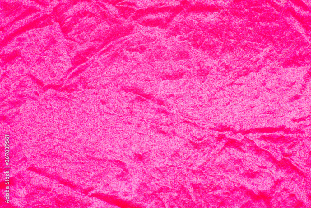 Fototapeta premium The texture of the silk fabric rose-color, pink crumpled silk texture