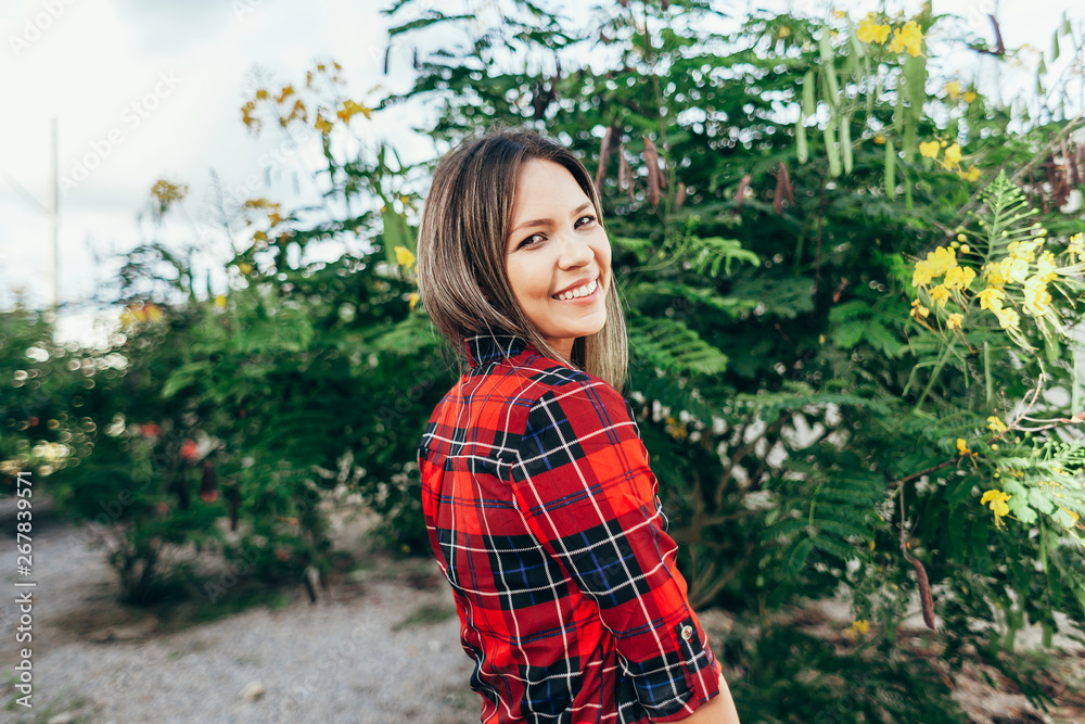 Portrait of beautiful young woman in the city