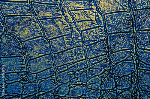 Abstract crocodile leather texture background  closeup. Blue and gold color.