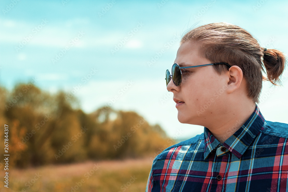 Guy in dark glasses on the background of nature. Guy in dark glasses on the background of nature.