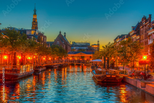 Night view of Koornbrug bridge in Leiden, Netherlands photo