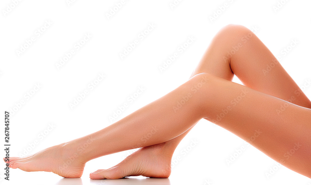 Long woman naked legs with smooth and clear skin isolated on white background Long woman naked legs with smooth and clear skin isolated on white background
