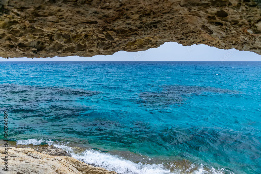 Magnificent view of the horizon from a cave on the shores of the Mediterranean Sea.