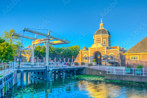 sunset view of Morspoort gate leading to the old town of Leiden, Netherlands photo