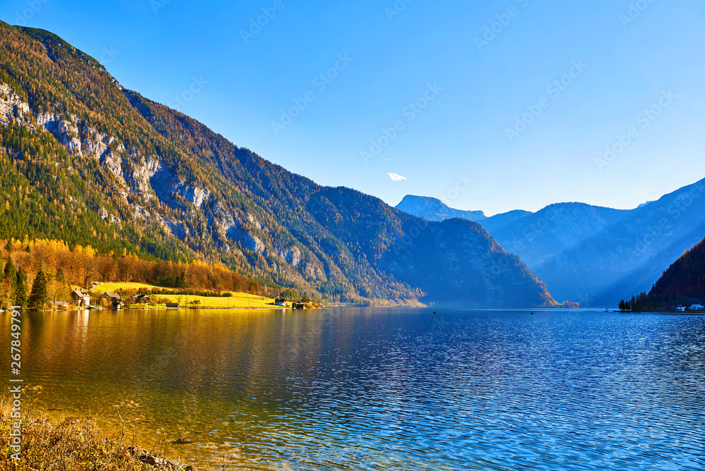 Hallstatt lake at sunny day, blue sky and mountain Sarstein. Late autumn, Salzkammergut region, Austria.