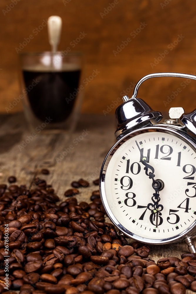 Fresh coffee and retro alarm clock. Concept of getting up to work. Morning awakening. Fresh coffee and retro alarm clock. Concept of getting up to work. Morning awakening.