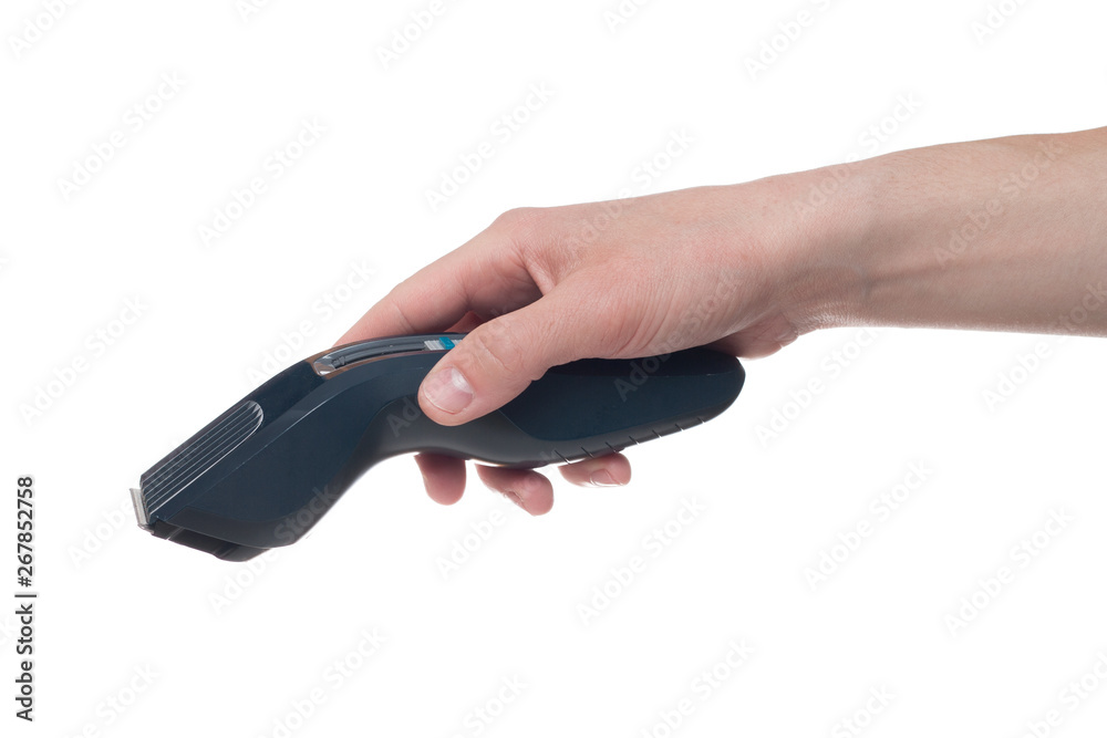 Hand holding Electric hair clippers isolated on white background. Hand holding Electric hair clippers isolated on white background.