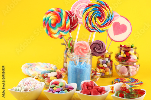 candies with jelly and sugar. colorful array of different childs sweets and treats. photo