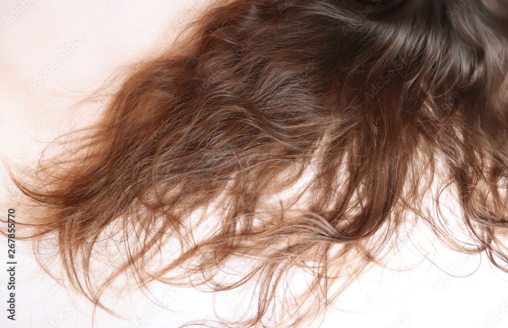 Naklejka premium Long, wavy brown hair. Teenage girl. 