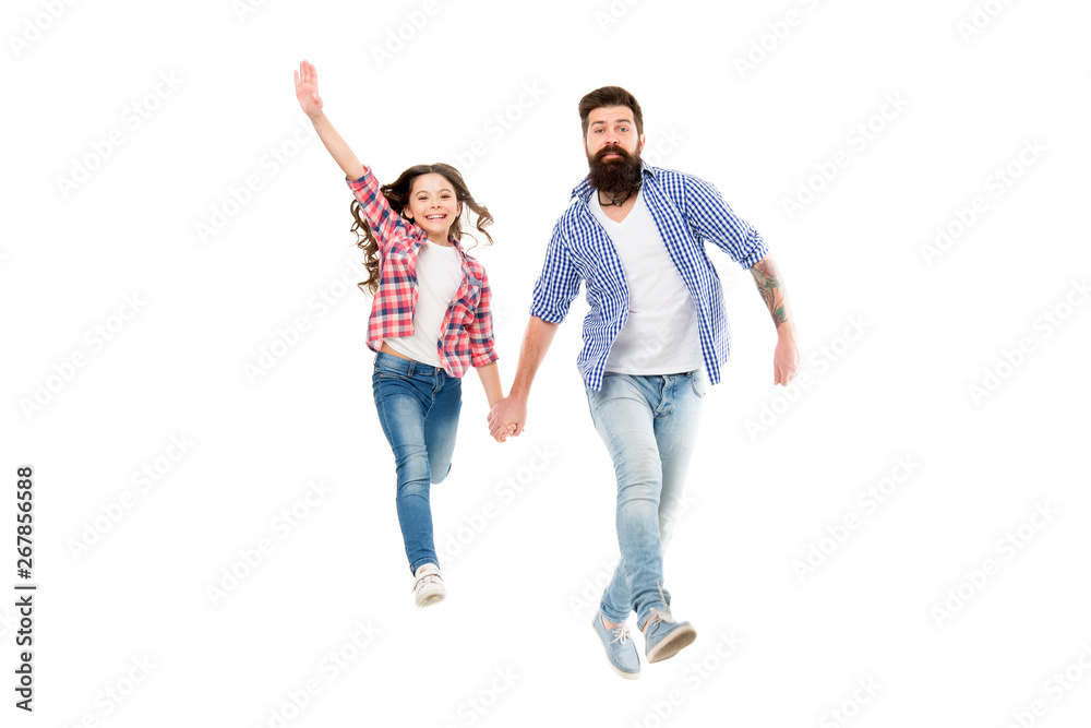 Like father like daughter. Bearded father and small girl child in casual hipster style holding hands. Happy father and adorable little daughter walking together. My father is my friend Like father like daughter. Bearded father and small girl child in casual hipster style holding hands. Happy father and adorable little daughter walking together. My father is my friend